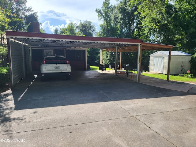 4010 Old Cottondale Rd, Marianna, FL 32448 - view of parking / parking lot with a storage shed, driveway, and a carport