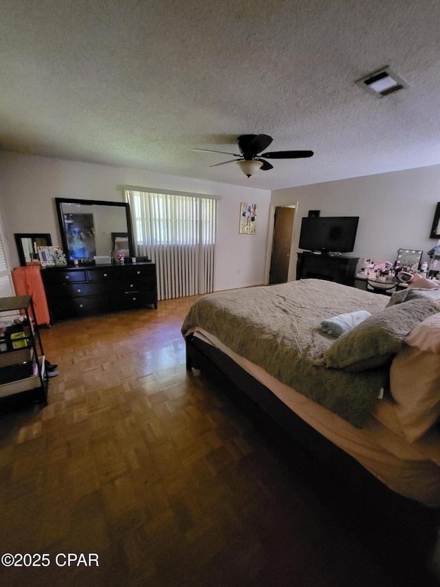 4010 Old Cottondale Rd, Marianna, FL 32448 - bedroom with a textured ceiling and ceiling fan