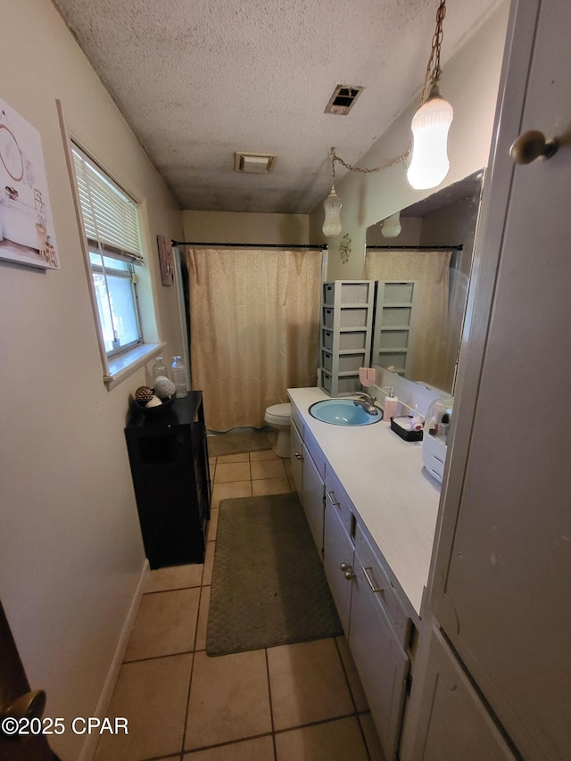 4010 Old Cottondale Rd, Marianna, FL 32448 - bathroom with tile patterned floors, vanity, a textured ceiling, and a shower with curtain