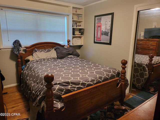 4010 Old Cottondale Rd, Marianna, FL 32448 - bedroom with wood finished floors and crown molding