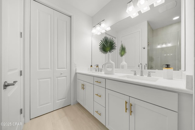 8648 Conch Shell Ct, Panama City Beach, FL 32413 - bathroom featuring double vanity, a tile shower, a closet, and tile patterned floors