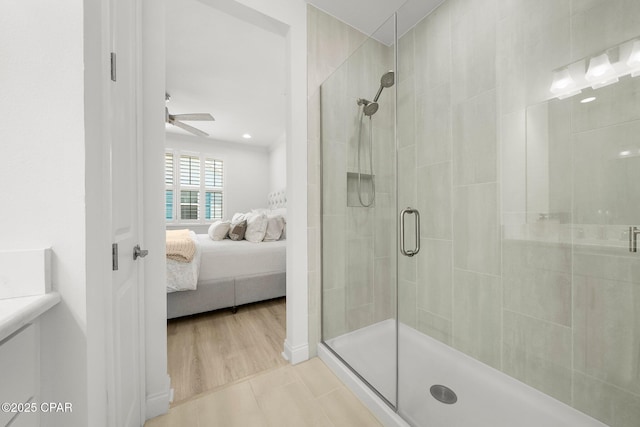 8648 Conch Shell Ct, Panama City Beach, FL 32413 - bathroom featuring a shower stall, connected bathroom, ceiling fan, and tile patterned floors