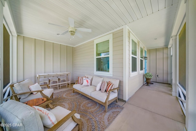 8648 Conch Shell Ct, Panama City Beach, FL 32413 - sunroom / solarium with an outdoor living space and a ceiling fan
