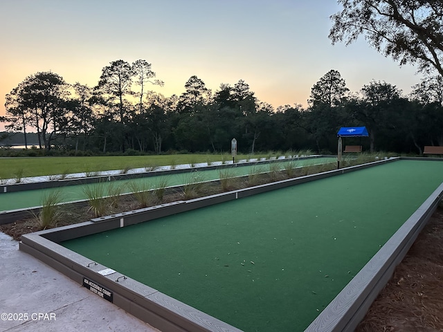 8648 Conch Shell Ct, Panama City Beach, FL 32413 - surrounding community with a bocce ball area and view of wooded area