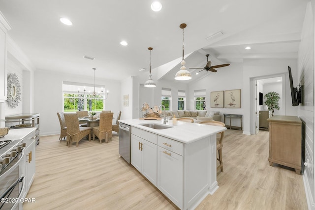 8648 Conch Shell Ct, Panama City Beach, FL 32413 - kitchen featuring stainless steel dishwasher, ceiling fan, recessed lighting, light wood finished floors, and light countertops