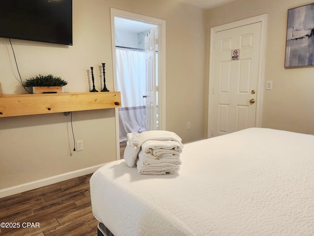 184 White Cap Way, Panama City Beach, FL 32407 - bedroom with dark wood-style floors and baseboards