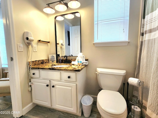 184 White Cap Way, Panama City Beach, FL 32407 - bathroom with vanity, wood finished floors, and a shower with shower curtain