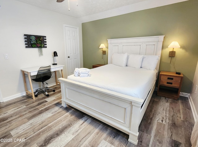 184 White Cap Way, Panama City Beach, FL 32407 - bedroom featuring wood finished floors, a desk, and a ceiling fan