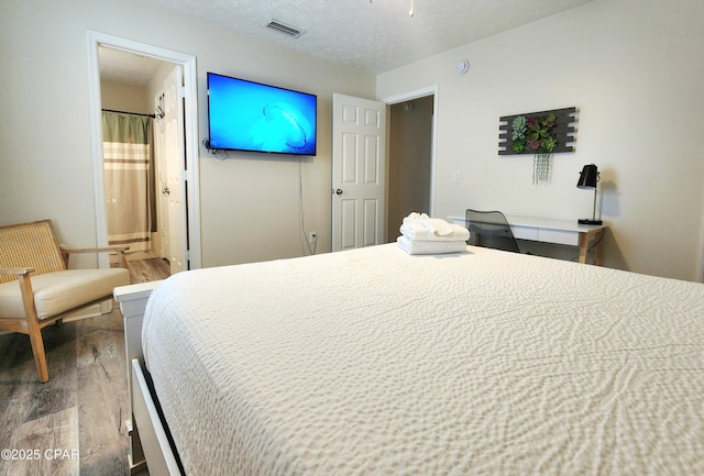 184 White Cap Way, Panama City Beach, FL 32407 - bedroom featuring wood finished floors and ensuite bathroom