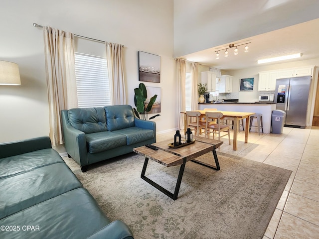 184 White Cap Way, Panama City Beach, FL 32407 - living room with light tile patterned floors and track lighting