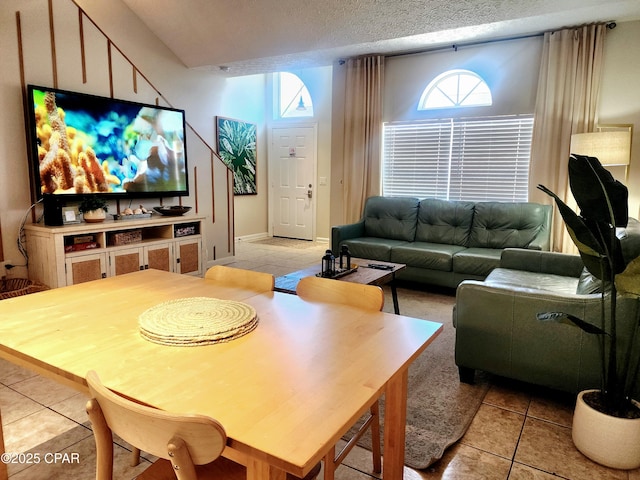 184 White Cap Way, Panama City Beach, FL 32407 - living area with light tile patterned floors, plenty of natural light, and a textured ceiling