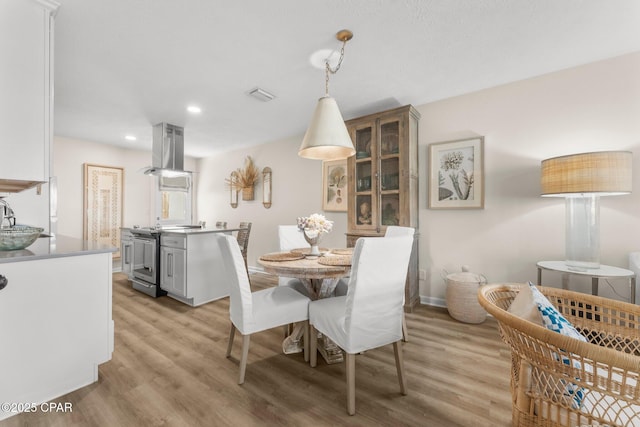 17642 Front Beach Rd Unit B1, Panama City Beach, FL 32413 - dining room featuring light wood-style flooring and recessed lighting