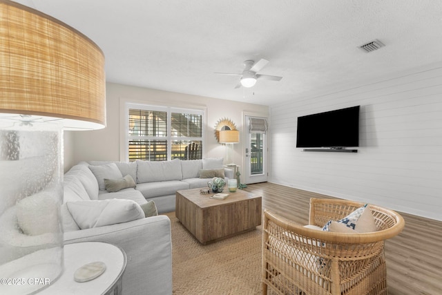 17642 Front Beach Rd Unit B1, Panama City Beach, FL 32413 - living area featuring ceiling fan and wood finished floors