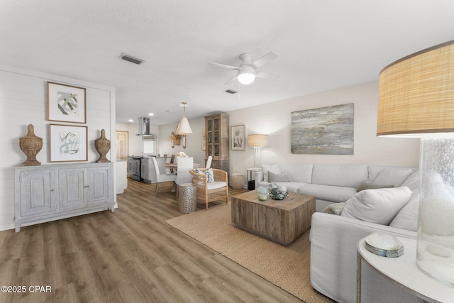 17642 Front Beach Rd Unit B1, Panama City Beach, FL 32413 - living room with ceiling fan and wood finished floors