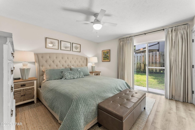 17642 Front Beach Rd Unit B1, Panama City Beach, FL 32413 - bedroom with access to outside, light wood-style flooring, a textured ceiling, and ceiling fan