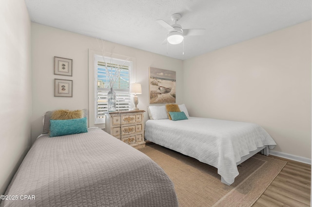 17642 Front Beach Rd Unit B1, Panama City Beach, FL 32413 - bedroom featuring wood finished floors and ceiling fan