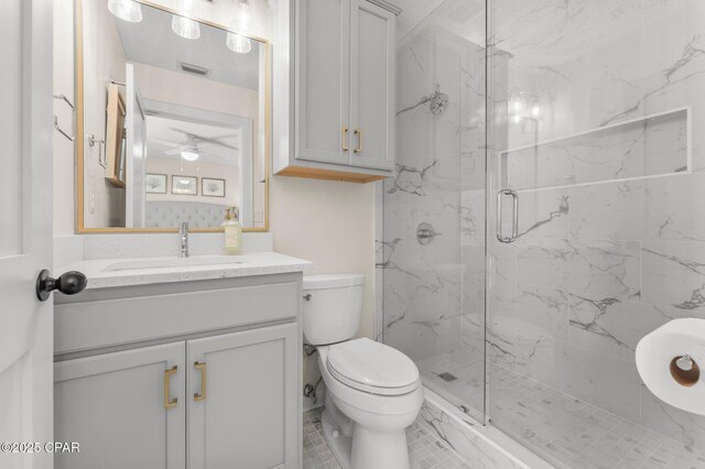 17642 Front Beach Rd Unit B1, Panama City Beach, FL 32413 - full bathroom with a marble finish shower, vanity, and a ceiling fan