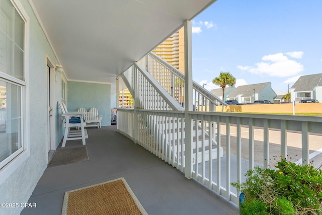 17642 Front Beach Rd Unit B1, Panama City Beach, FL 32413 - balcony with stairs and a residential view