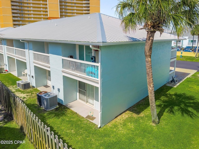 17642 Front Beach Rd Unit B1, Panama City Beach, FL 32413 - back of property featuring stucco siding, a metal roof, and a balcony