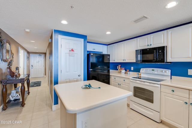 10811 Front Beach Rd Unit 2304, Panama City Beach, FL 32407 - kitchen featuring black appliances, light tile patterned floors, light countertops, white cabinets, and a textured ceiling