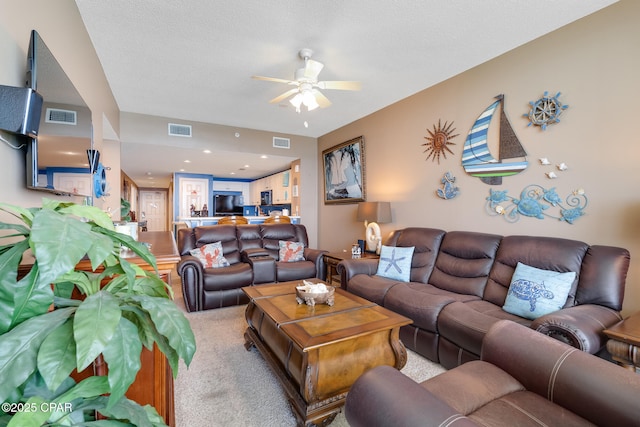 10811 Front Beach Rd Unit 2304, Panama City Beach, FL 32407 - living room featuring a ceiling fan and carpet