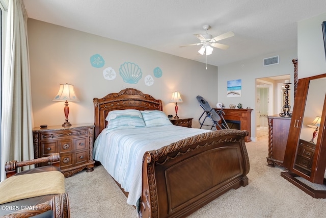 10811 Front Beach Rd Unit 2304, Panama City Beach, FL 32407 - carpeted bedroom featuring a fireplace and ceiling fan