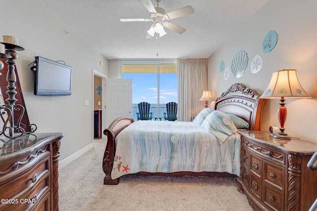 10811 Front Beach Rd Unit 2304, Panama City Beach, FL 32407 - bedroom featuring light carpet, a textured ceiling, and ceiling fan
