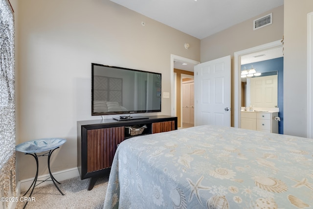 10811 Front Beach Rd Unit 2304, Panama City Beach, FL 32407 - carpeted bedroom with baseboards and connected bathroom