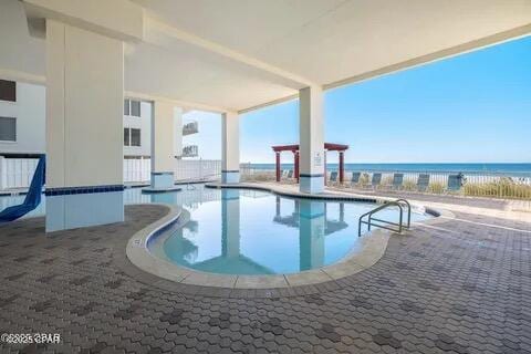 10811 Front Beach Rd Unit 2304, Panama City Beach, FL 32407 - community pool with a patio and a water view