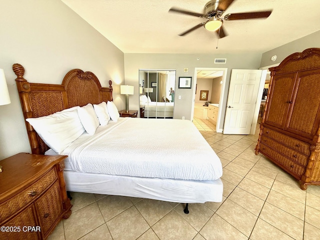 14701 Front Beach Rd Unit 536, Panama City Beach, FL 32413 - bedroom with light tile patterned flooring, a ceiling fan, and ensuite bathroom