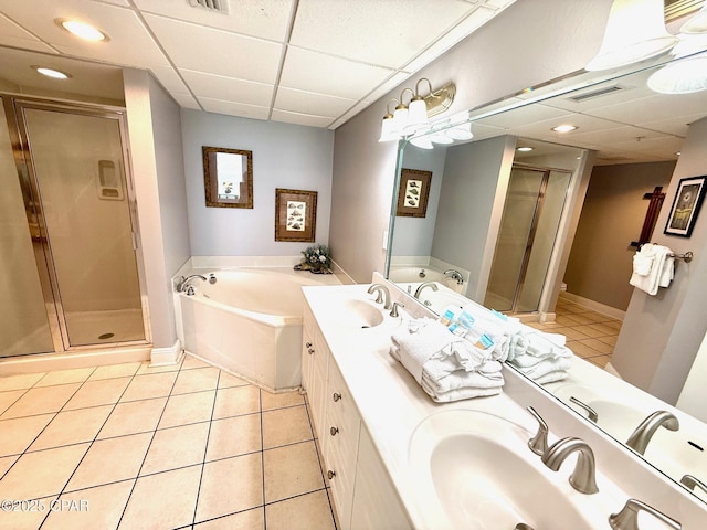14701 Front Beach Rd Unit 536, Panama City Beach, FL 32413 - full bath featuring a stall shower, a drop ceiling, tile patterned flooring, a garden tub, and double vanity