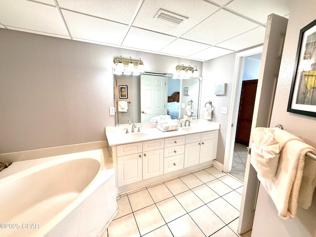 14701 Front Beach Rd Unit 536, Panama City Beach, FL 32413 - bathroom with a drop ceiling, tile patterned floors, double vanity, and a garden tub