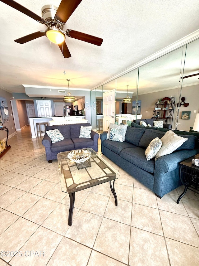 14701 Front Beach Rd Unit 536, Panama City Beach, FL 32413 - living room with light tile patterned flooring, ceiling fan, and ornamental molding
