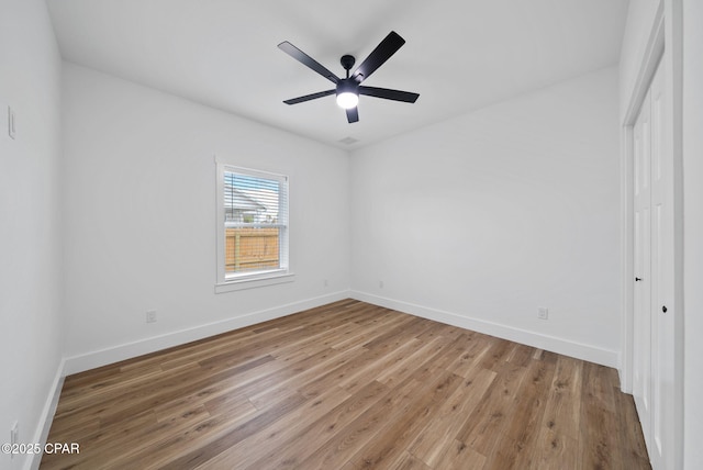 1306 E 26th St, Lynn Haven, FL 32444 - unfurnished bedroom with wood finished floors, ceiling fan, and a closet