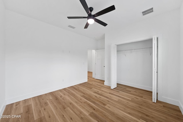 1306 E 26th St, Lynn Haven, FL 32444 - unfurnished bedroom with wood finished floors, a closet, and a ceiling fan