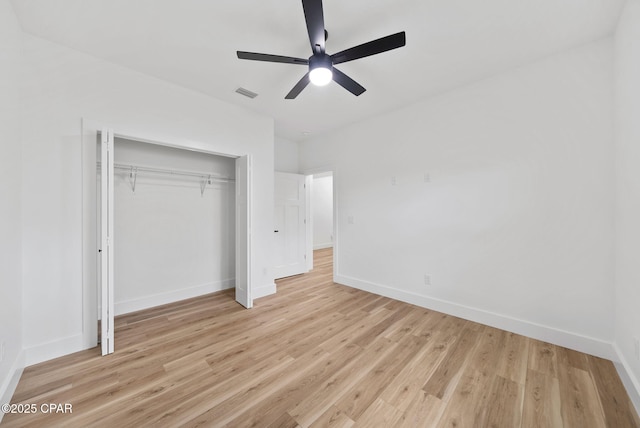 1306 E 26th St, Lynn Haven, FL 32444 - unfurnished bedroom featuring a closet, light wood-style floors, and ceiling fan