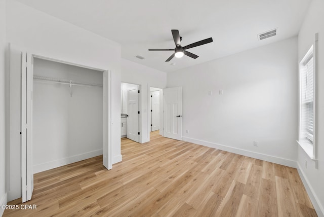 1306 E 26th St, Lynn Haven, FL 32444 - unfurnished bedroom with light wood-style flooring and multiple windows