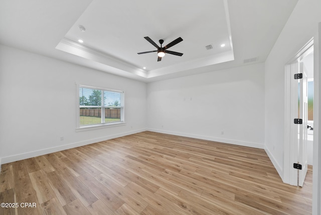 1306 E 26th St, Lynn Haven, FL 32444 - unfurnished room with a tray ceiling, crown molding, light wood-style floors, ceiling fan, and recessed lighting