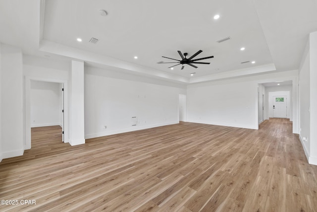 1306 E 26th St, Lynn Haven, FL 32444 - unfurnished living room with a raised ceiling, a ceiling fan, crown molding, light wood-style flooring, and recessed lighting