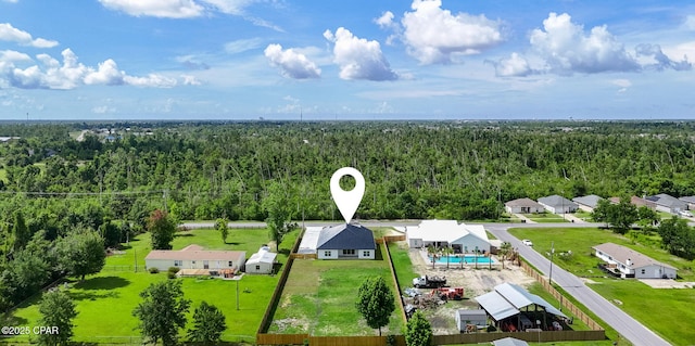 1306 E 26th St, Lynn Haven, FL 32444 - aerial view of residential area featuring a heavily wooded area and a pool