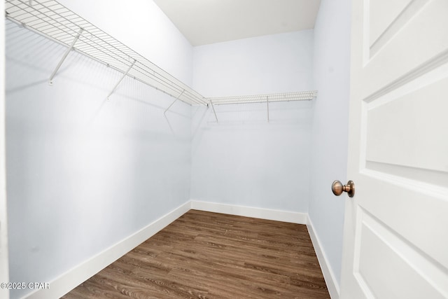 112 Christopher Dr Unit B, Panama City Beach, FL 32413 - spacious closet featuring dark wood-style flooring