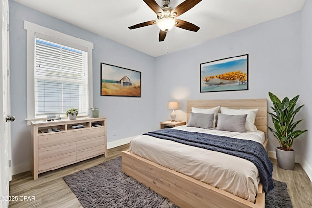 112 Christopher Dr Unit B, Panama City Beach, FL 32413 - bedroom with light wood-style floors and ceiling fan