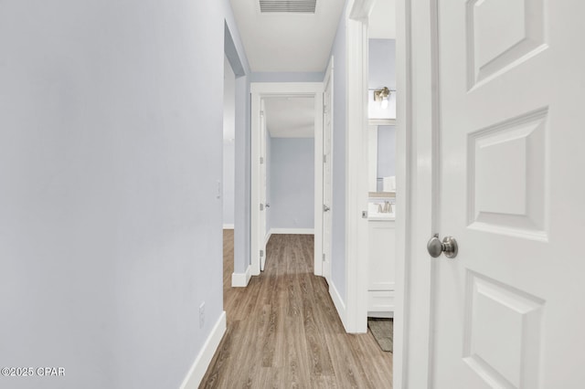 112 Christopher Dr Unit B, Panama City Beach, FL 32413 - hall with light wood-style floors and baseboards