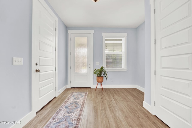 112 Christopher Dr Unit B, Panama City Beach, FL 32413 - foyer with light wood finished floors and baseboards