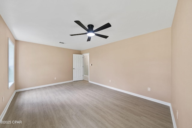 1601 Loblolly Ln, Lynn Haven, FL 32444 - spare room with wood finished floors and a ceiling fan