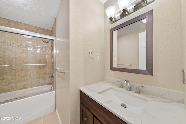 1601 Loblolly Ln, Lynn Haven, FL 32444 - bathroom with vanity, enclosed tub / shower combo, a textured wall, and tile patterned floors