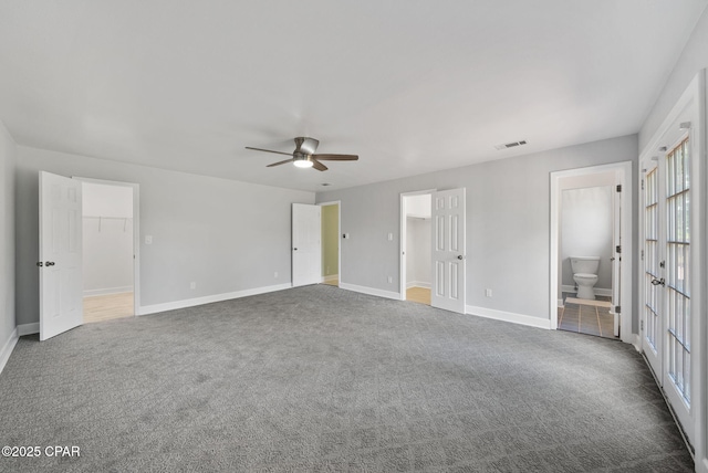 1601 Loblolly Ln, Lynn Haven, FL 32444 - unfurnished bedroom with a spacious closet, carpet, a closet, and french doors