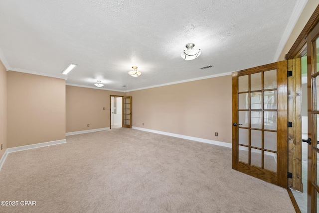 1601 Loblolly Ln, Lynn Haven, FL 32444 - unfurnished room with a textured ceiling, crown molding, carpet, and french doors