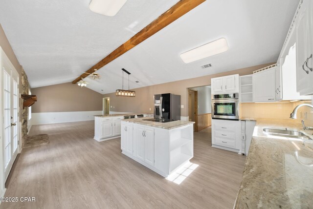 1601 Loblolly Ln, Lynn Haven, FL 32444 - kitchen with open shelves, stainless steel appliances, light wood finished floors, light stone counters, and white cabinets