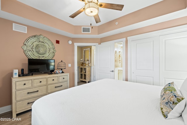 15928 Front Beach Rd Unit 3-2005, Panama City Beach, FL 32413 - bedroom featuring dark wood-style flooring, a closet, connected bathroom, and a ceiling fan